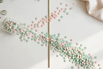 Glass jar of pastel tokens split into two streams — Make AI credit pricing split