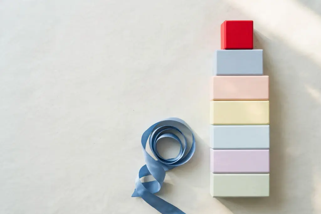Tall tower of pastel blocks with red top block — the winning automation platform choice