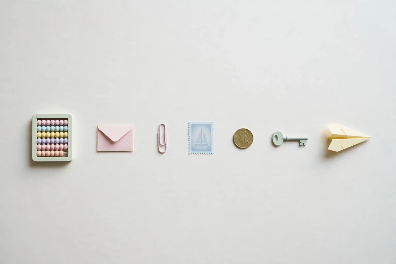 Seven pastel desk props in a row — a complete toolkit