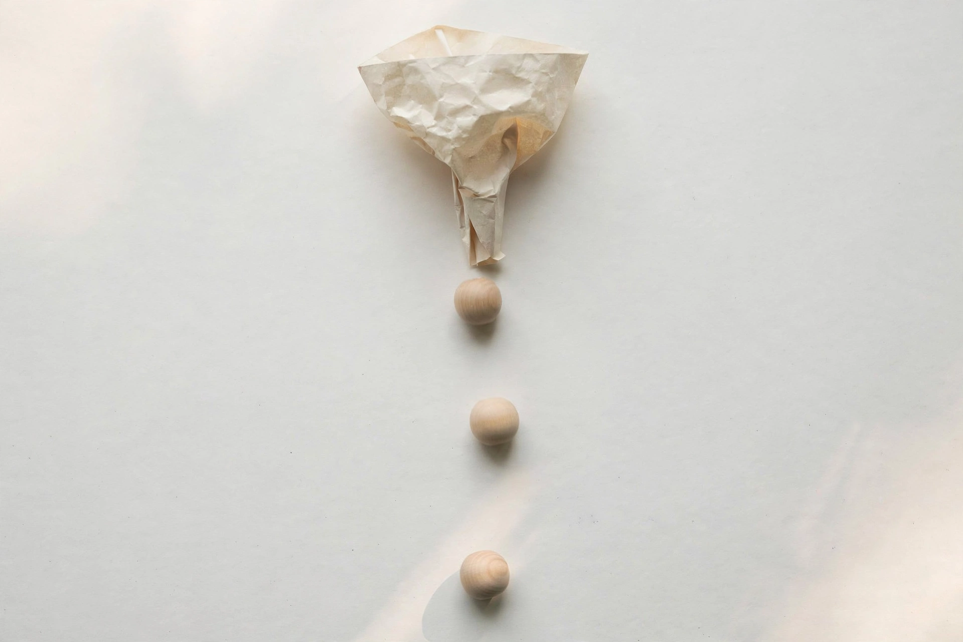Paper funnel with beads — lead enrichment pipeline