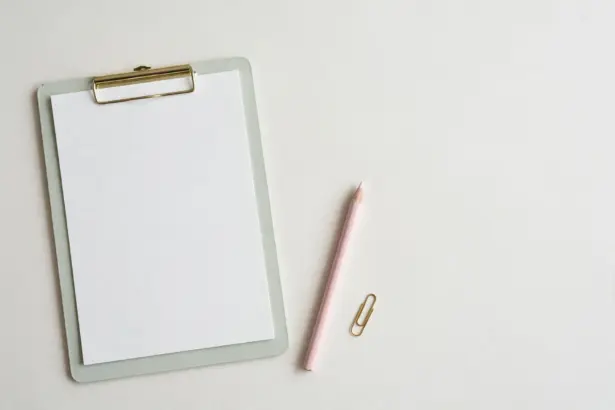Pastel clipboard with blank score sheet and pencil — benchmarking an AI support agent