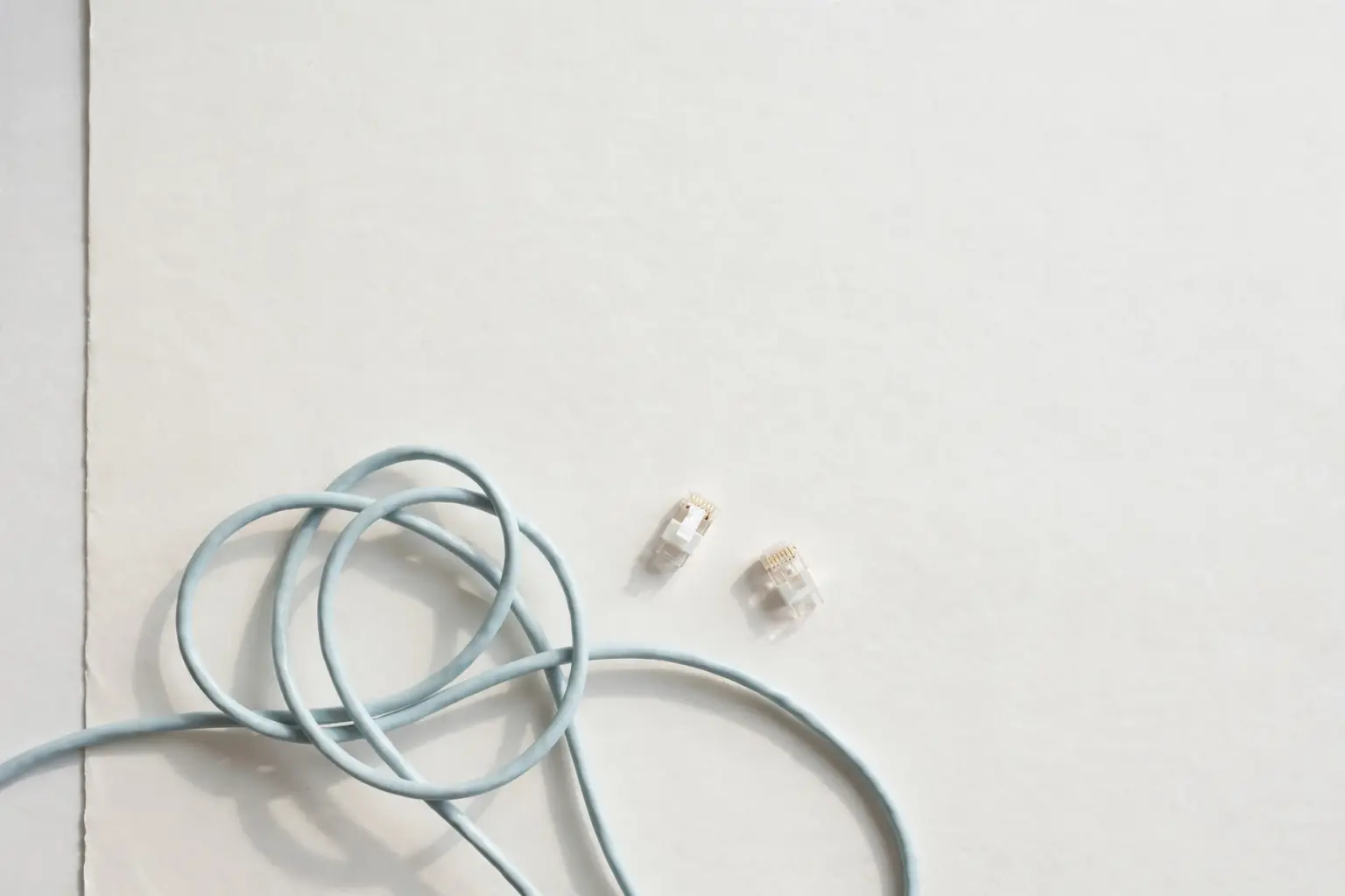 Pale-blue network cables and connector plugs — connecting systems