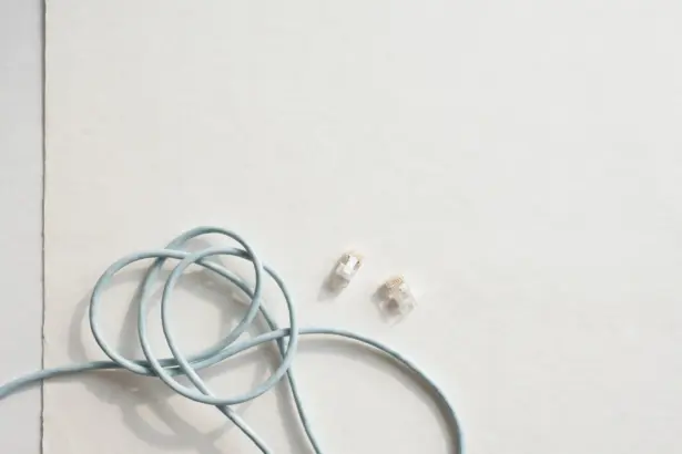 Pale-blue network cables and connector plugs — connecting systems